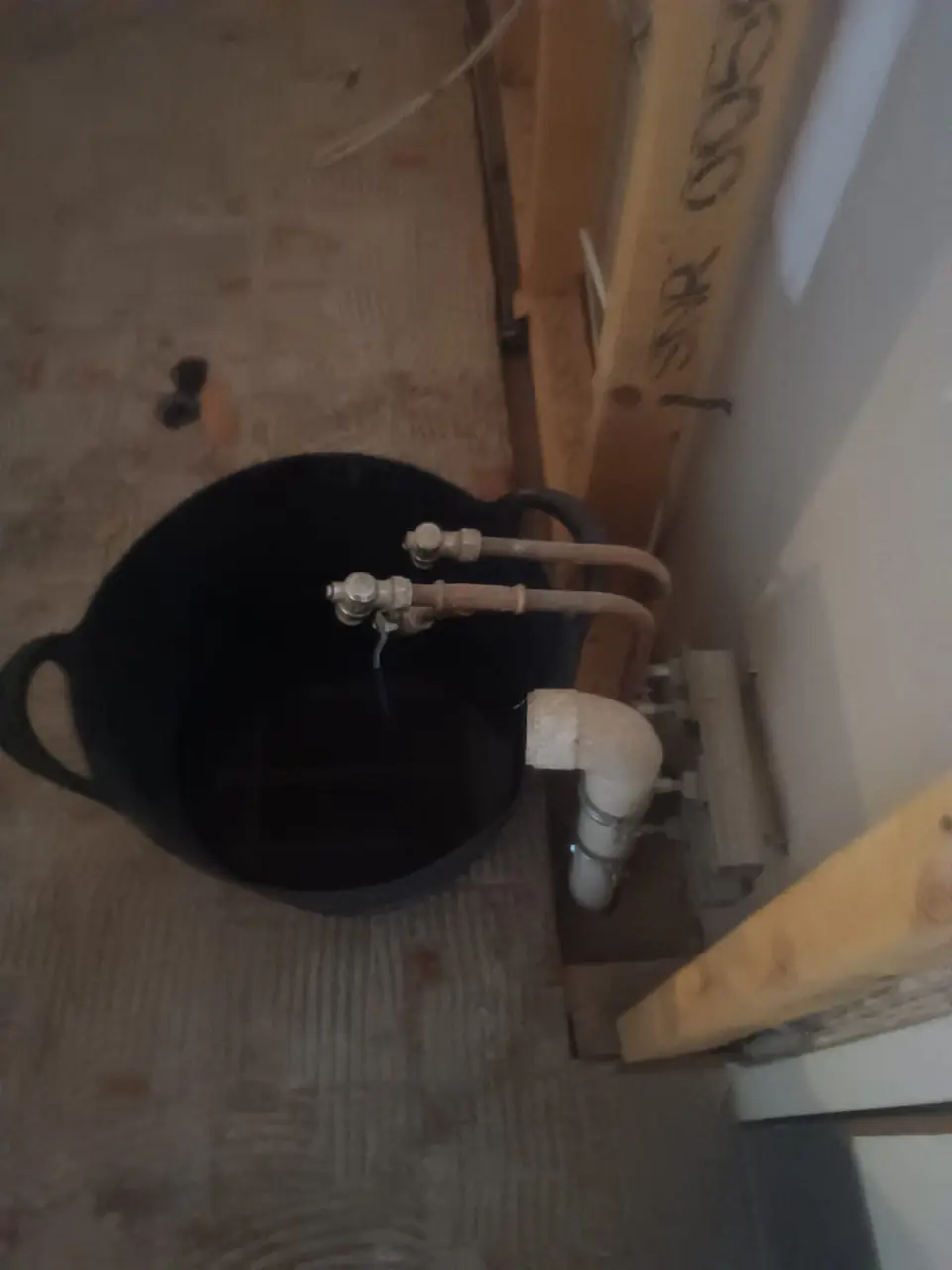 New water supply pipes and white waste pipework installed during a first fix