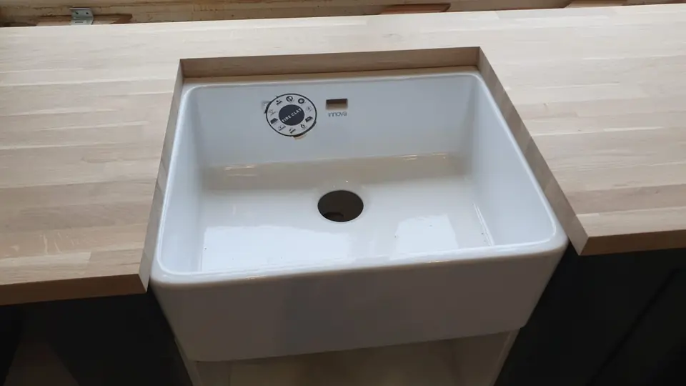 White Belfast sink set into a solid oak worktop